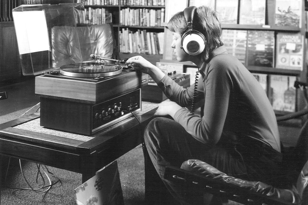 man lsitening to music through headphones. man lsitening to music through headphones.