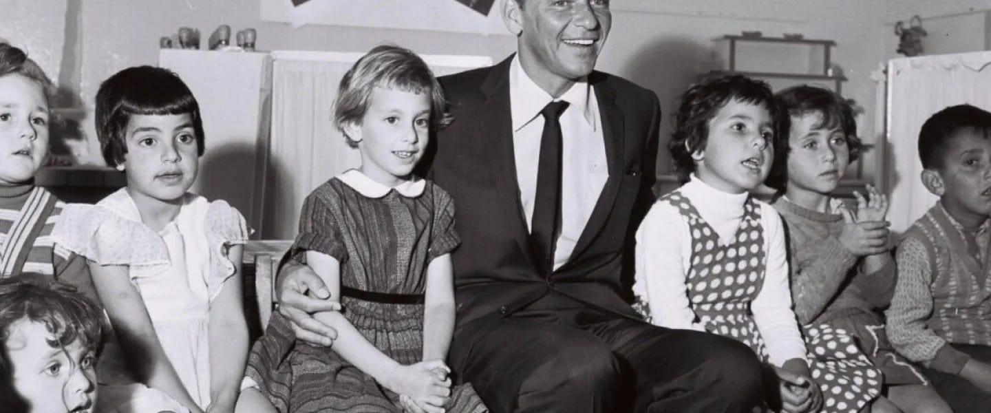 Frank Sinatra visiting a kindergarten in Nazareth Illit, 1962. Credit: GPO.