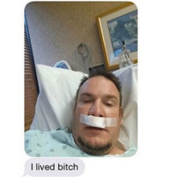 The "I lived bitch" meme: a white man with a goatee clearly in a hospital bed, sending a selfie with the text "I lived bitch"