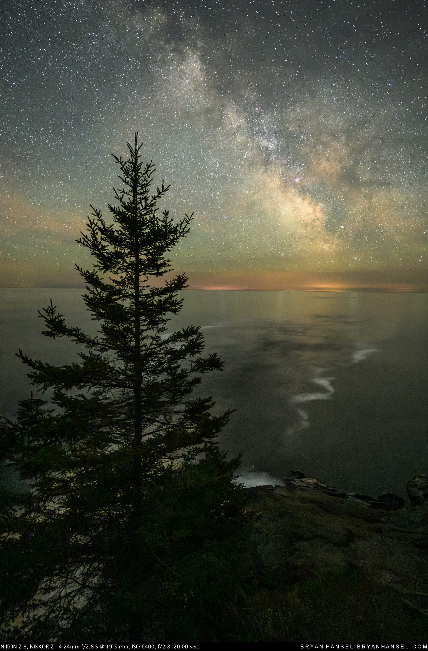 A spruce under the Milky Way and over the Cascade River which flows towards the galactic core A spruce under the Milky Way and over the Cascade River which flows towards the galactic core