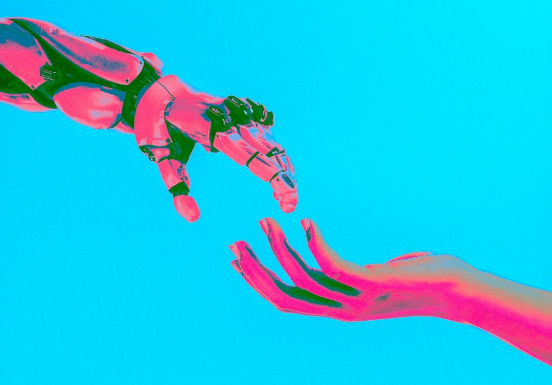 two hands reaching for a flying object in the sky