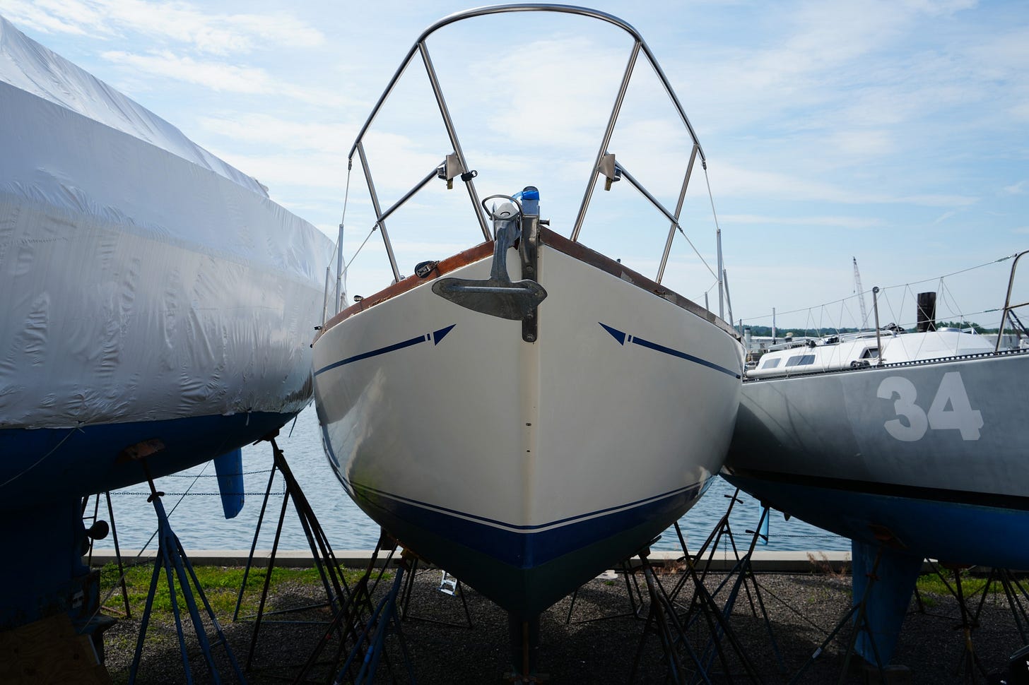 May be an image of sail, boat and text