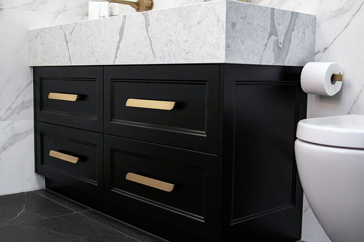 luxurious black and white ensuite bathroom designed by Plush Design Interiors and Penelope Herbert