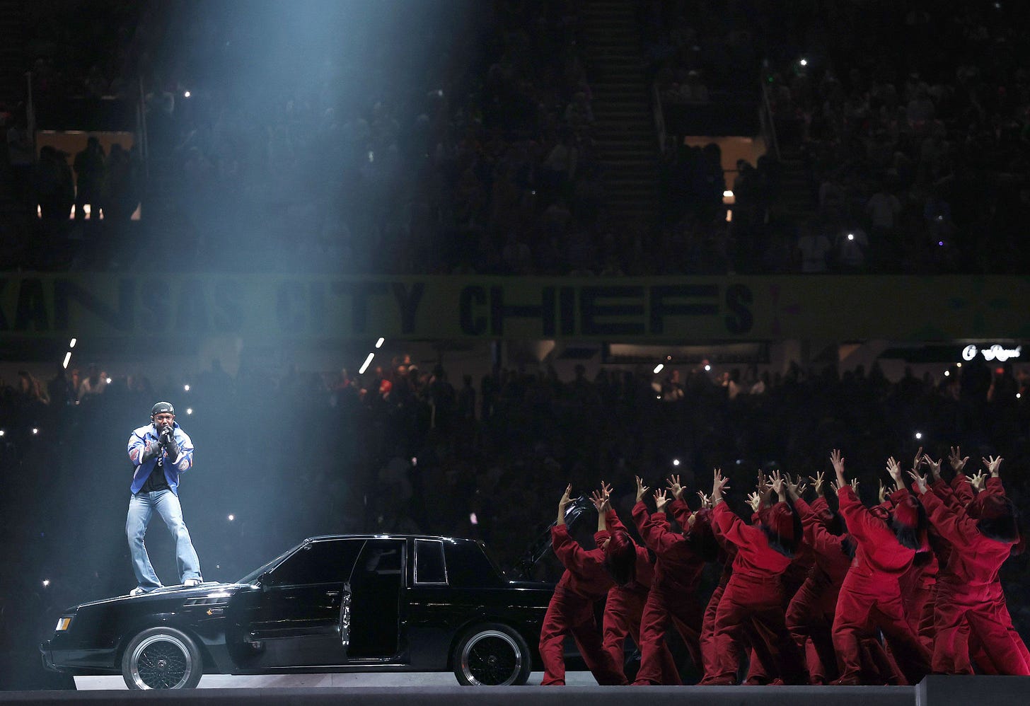 Kendrick Lamar opens his Super Bowl halftime show on the hood of a car on Sunday, February 9. Kendrick Lamar opens his Super Bowl halftime show on the hood of a car on Sunday, February 9.
