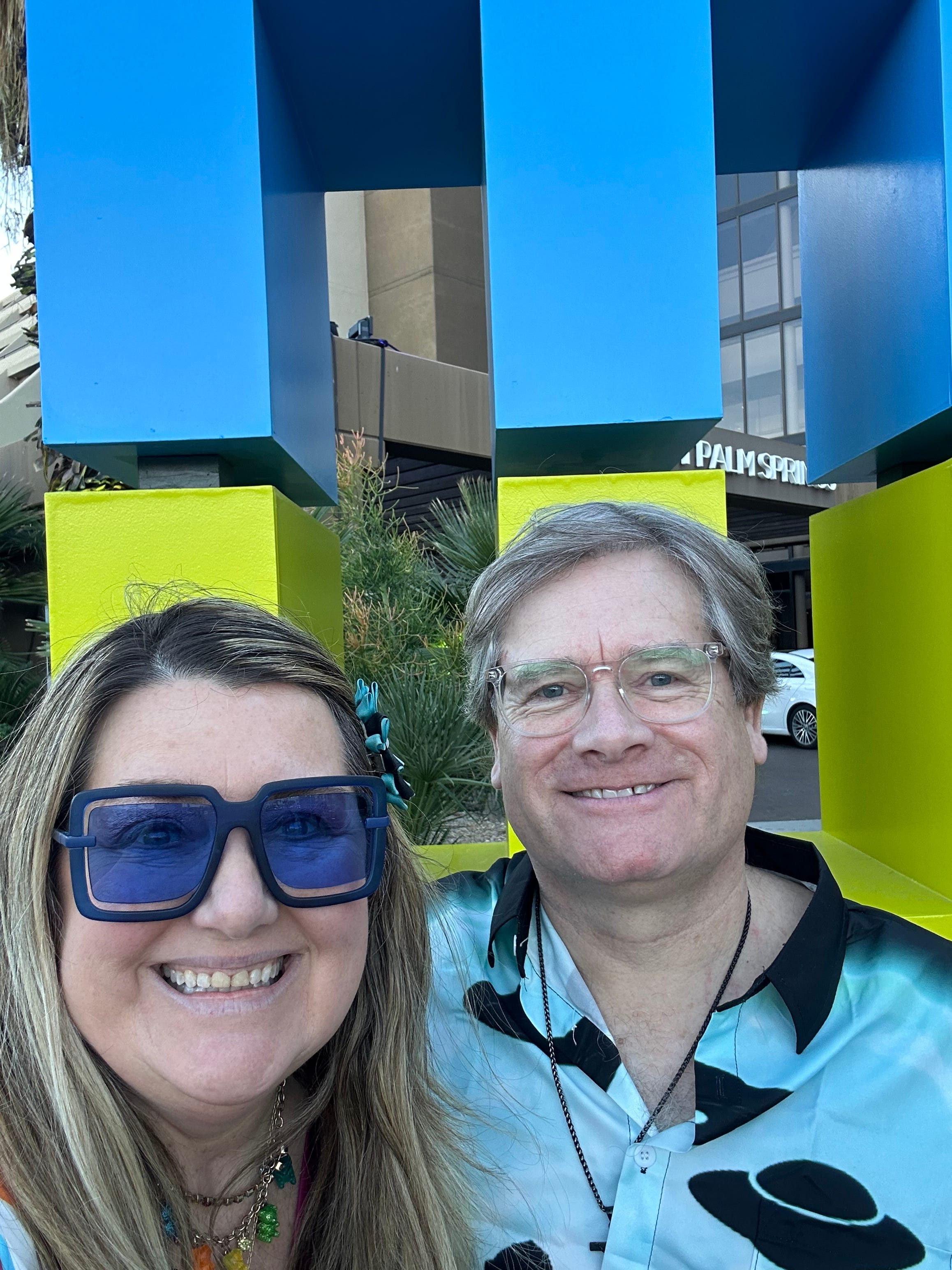 Me and Wade in front of the Modernism Week logo at the Hyatt Regency Palm Springs - February 2025