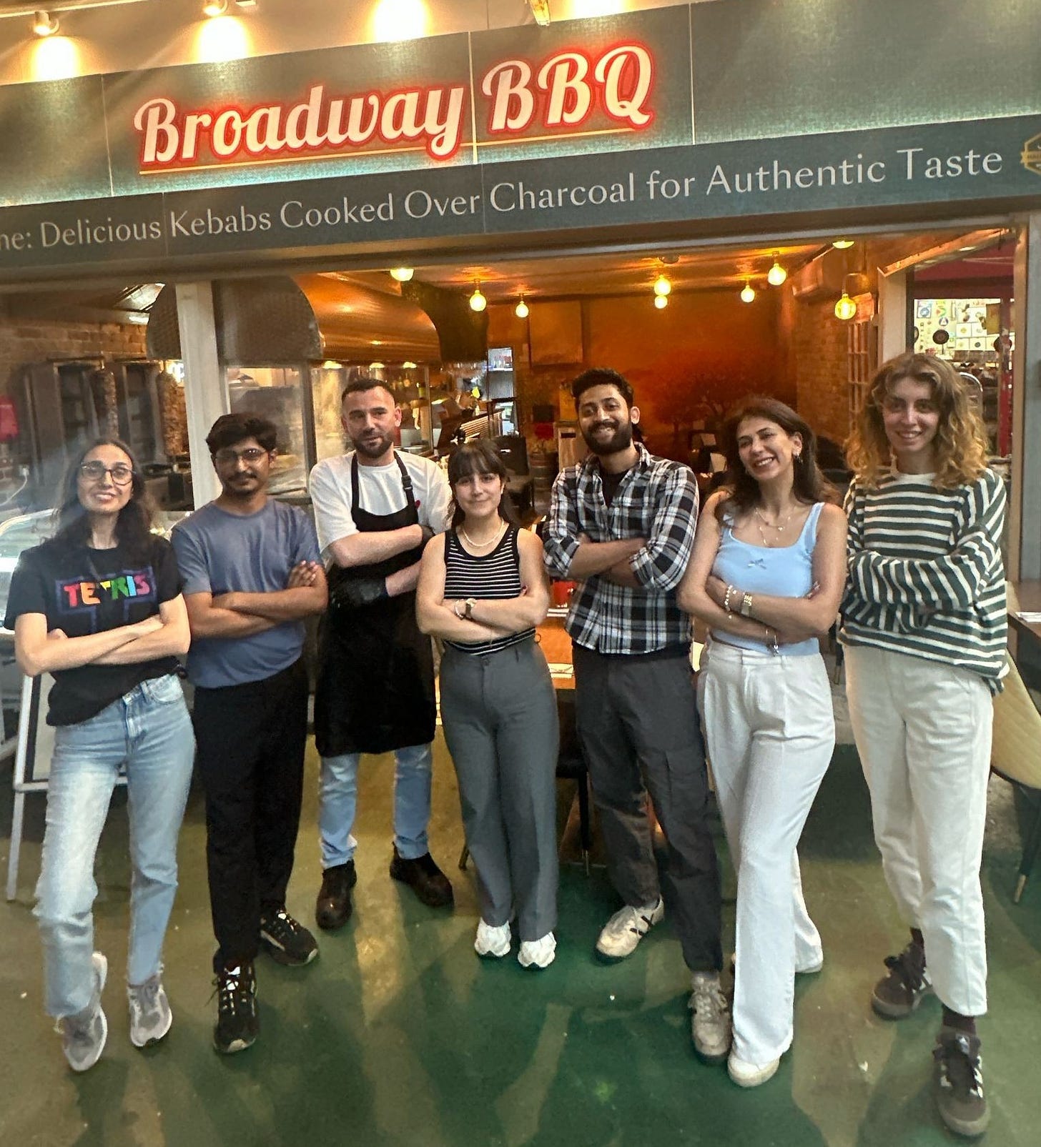 May be an image of 7 people and text that says "Broadway BroadwayBBC BBQ e: e: Delicious Kebabs Cooked Over Charcoal for Authentic Taste"
