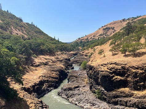 Waterfall, kayak in a lake, rapids along a river