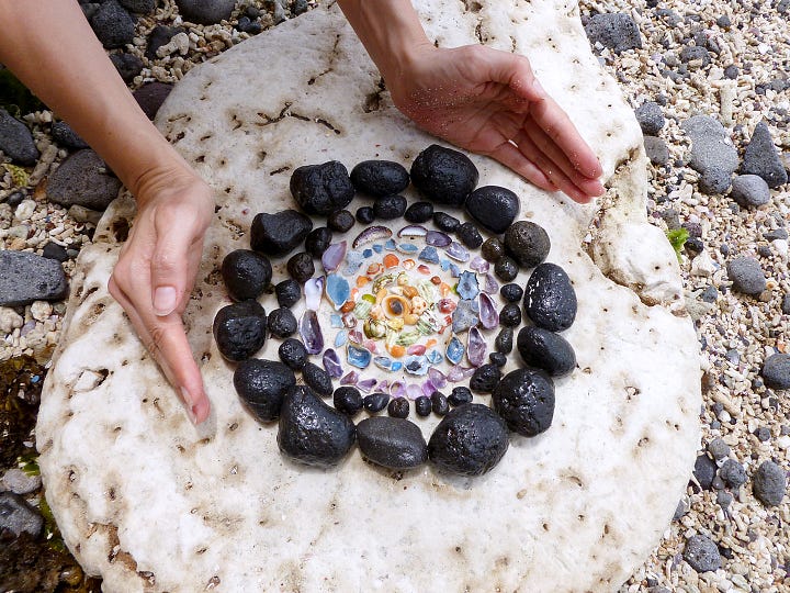 Mandala on beach, pine needles in bark, ice between trees, snow pattern on tree trunk