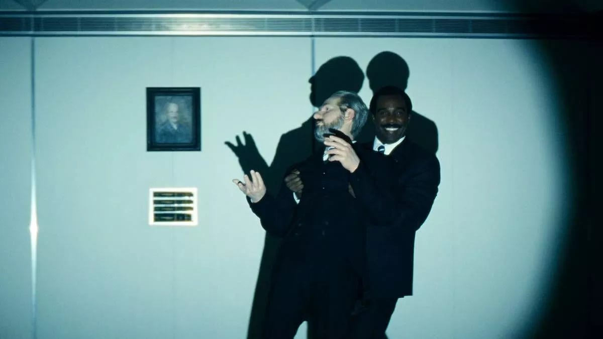 Milchick wheeling in the statue of Kier Egan in the season 2 finale