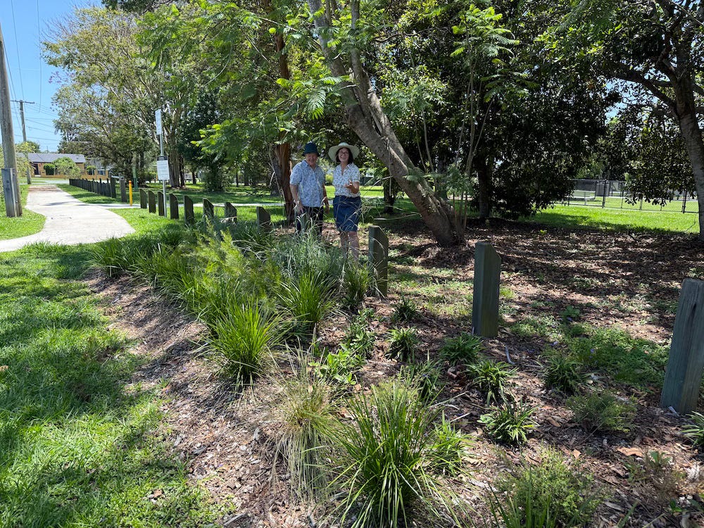 long shot of garden with two people