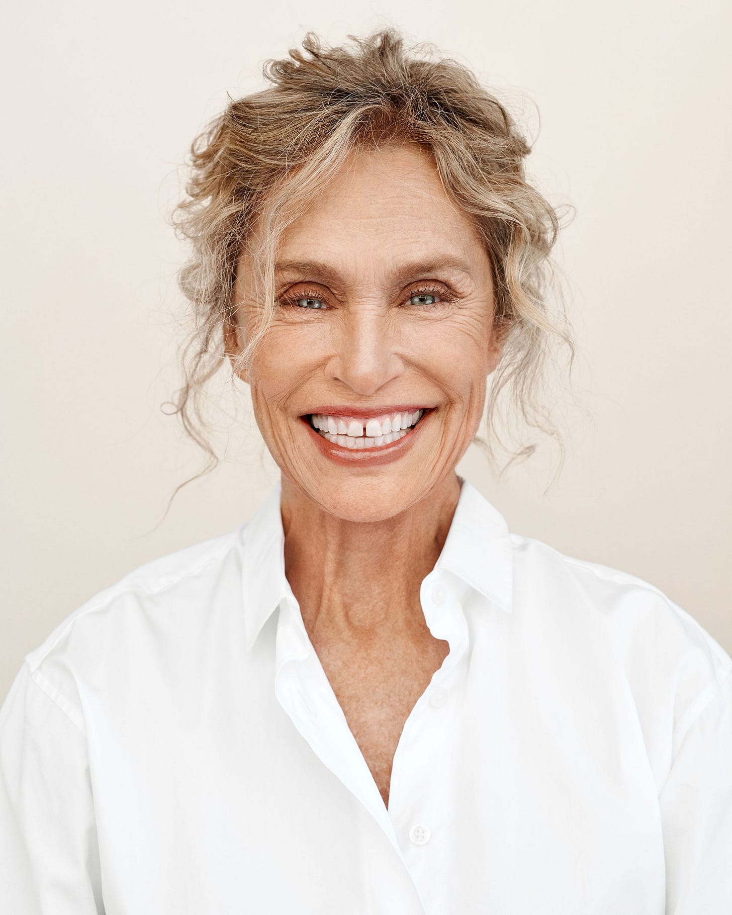 Image may contain Lauren Hutton Face Human Smile Person Clothing Shirt Apparel and Doctor