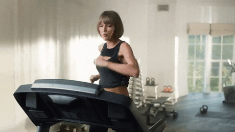 A woman running on a treadmill celebrating then falling on their face. A woman running on a treadmill celebrating then falling on their face.