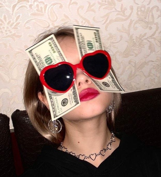 This may contain: a woman wearing heart shaped sunglasses with money sticking out of her eyes on top of her head