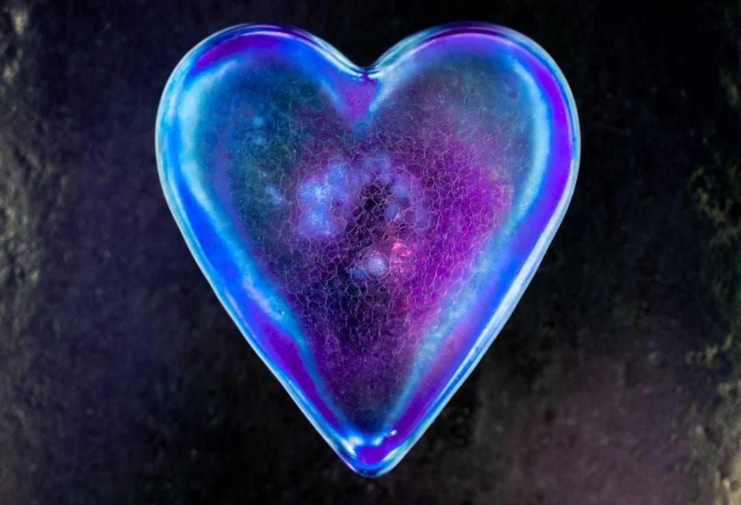 purple heart shaped ornament on black and white textile