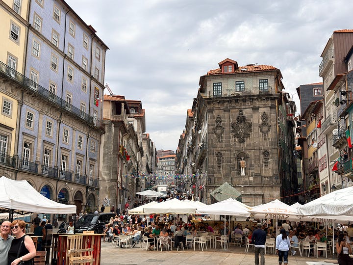 Early afternoon crowds of Festas de São João, and a picture of some men roasting pork