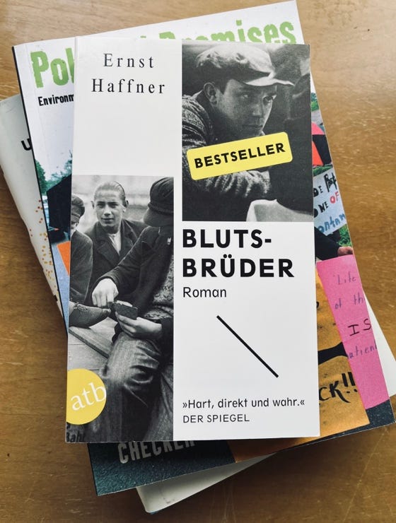 A stack of books on a table

AI-generated content may be incorrect.
