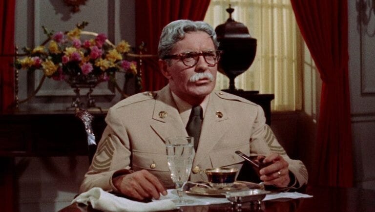 Actor Tyrone Power as Marty Maher in The Long Gray Line movie. Army officer at a table.