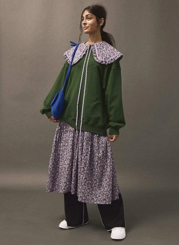 Layer your Eliza Faulkner cottage core dress (after a wedding) with a crewneck sweater to turn it into a more everyday outfit. 
