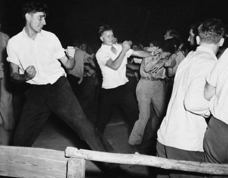 Fighting rages at picnic grove in Peekskill, New York, the night of Aug. 27,1949 as veterans break up scheduled concert by black singer Paul Robeson.  (AP Photo)
