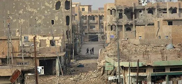 A city street in Ramadi, heavily damaged by intense urban fighting in 2006, highlighting the devastation of conflict. A city street in Ramadi, heavily damaged by intense urban fighting in 2006, highlighting the devastation of conflict.