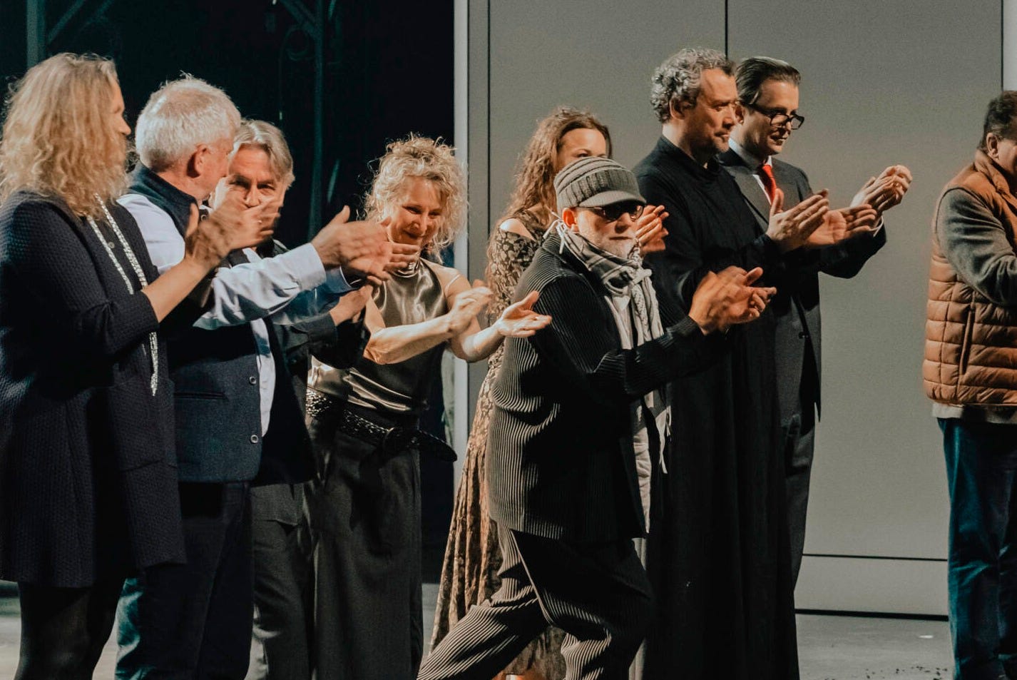 Simon McBurney (center, in the hat and keffiyeh) with members of the cast and creative team for Khovanshchina, after opening night. (Photo: Salzburg Easter Festival) Simon McBurney (center, in the hat and keffiyeh) with members of the cast and creative team for Khovanshchina, after opening night. (Photo: Salzburg Easter Festival)