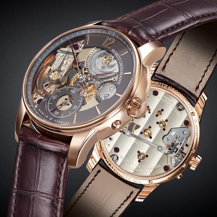 Visible here through the sapphire caseback, Caliber 107.0 is a mirror image of another Moritz Grossmann movement, Caliber 100.1. Visible here through the sapphire caseback, Caliber 107.0 is a mirror image of another Moritz Grossmann movement, Caliber 100.1.