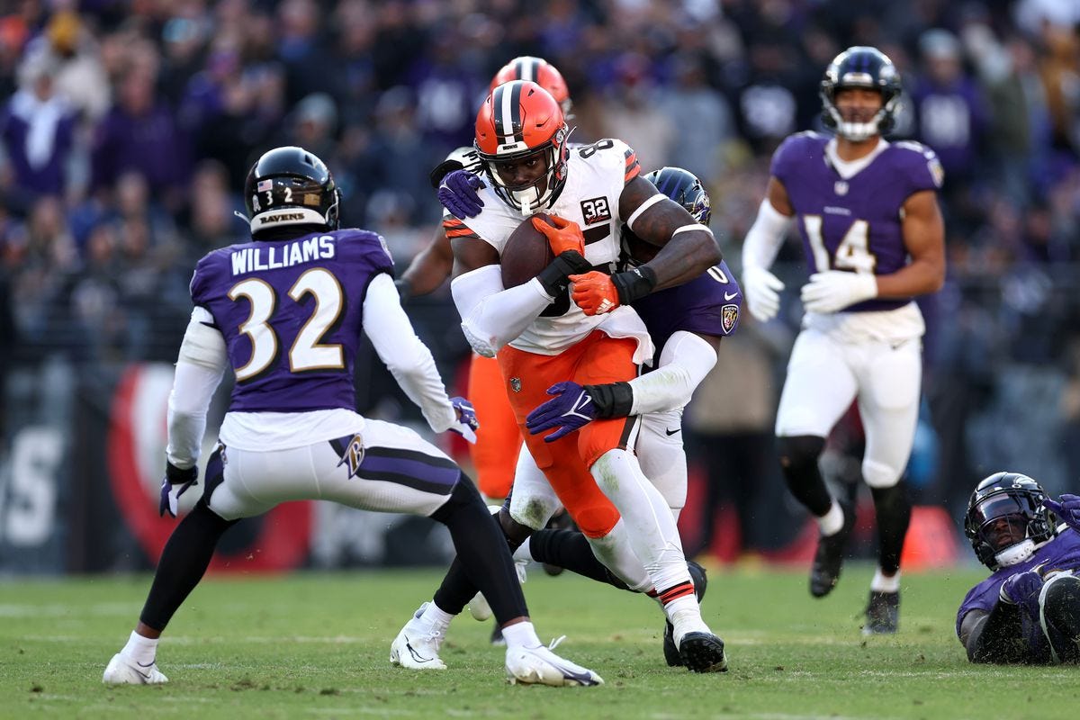 The Baltimore Ravens' defense struggles to take down Cleveland Browns TE David Njoku.