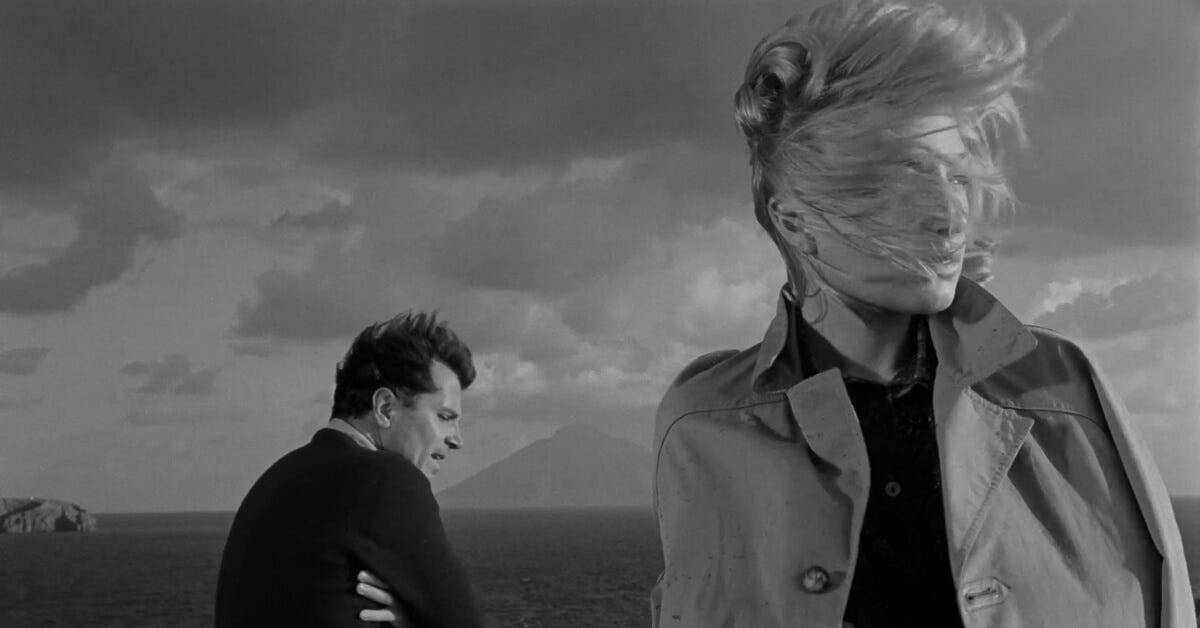 Iconic shot of Monica Vitti, hair blown in the wind, pensively facing away from Sandro while Stromboli looms on the horizon. Iconic shot of Monica Vitti, hair blown in the wind, pensively facing away from Sandro while Stromboli looms on the horizon.