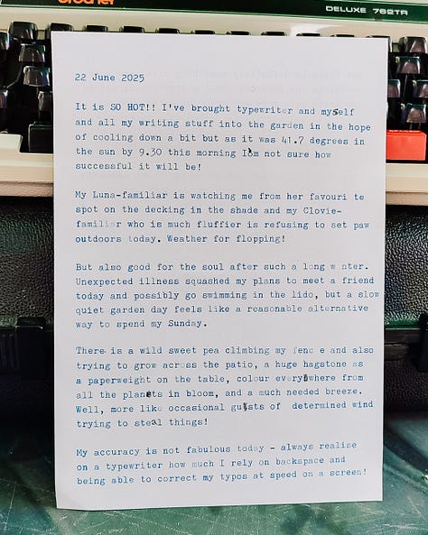 Typewritten pages in front of a typewriter on a table in the garden - see text below for what the pages say