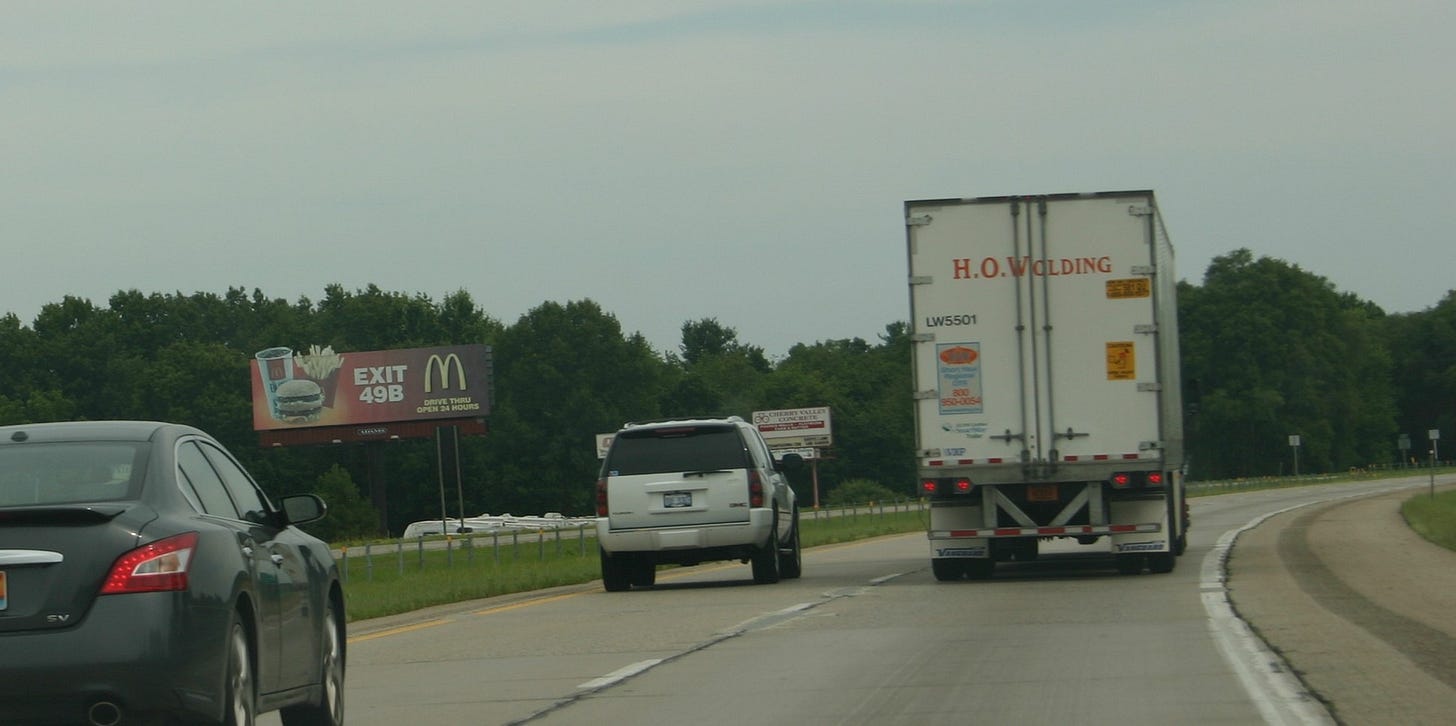 Truck and cars on freeway