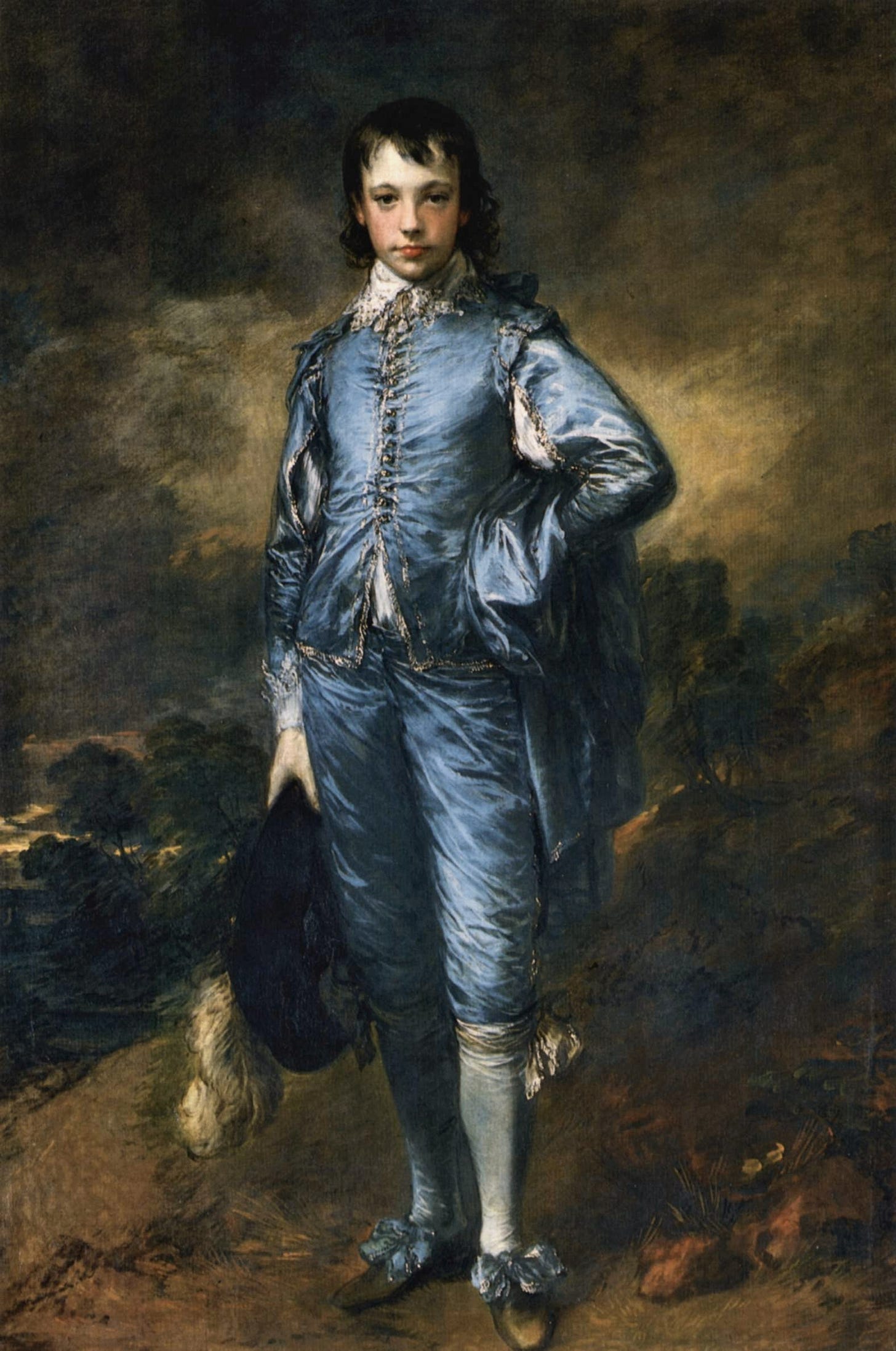 A boy in a shining blue satin suit stands on a path with one hand on his hip, holding a black hat with a white plume, under a stormy brown sky. A boy in a shining blue satin suit stands on a path with one hand on his hip, holding a black hat with a white plume, under a stormy brown sky.