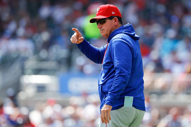 Manager Rob Thomson of the Philadelphia Phillies takes the mound for a pitching change in the fifth inning during the game between the Philadelphia...