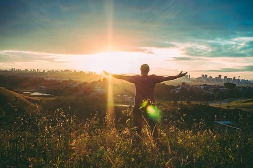 Person Spreading Hands Against Sun