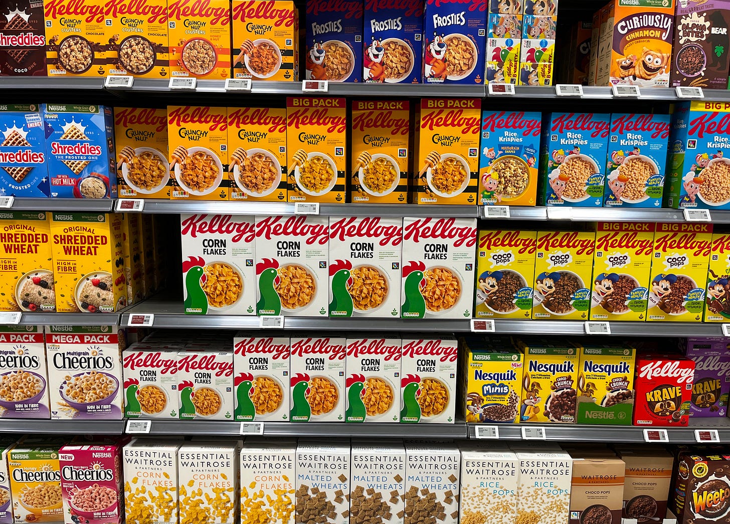 Photo of shelves in the cereal aisle in a supermarket. Photo of shelves in the cereal aisle in a supermarket.