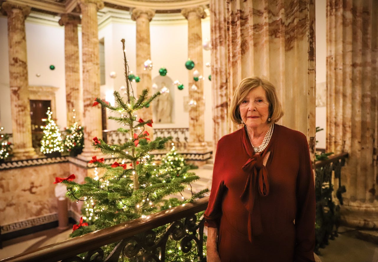 Lady Anne Glenconner in front of a xmas tree at Holkham Hall. 