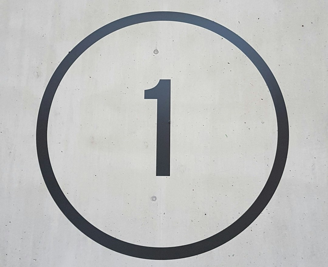 a number one sign on the side of a building