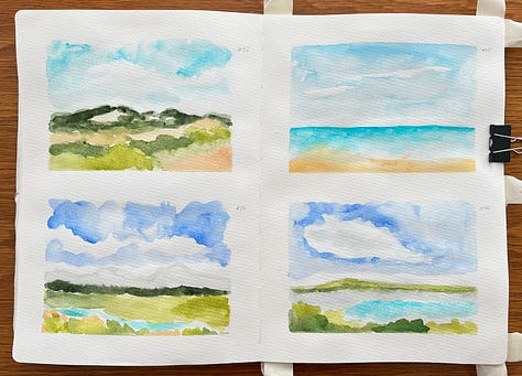 Watercolour landscapes in a sketchbook