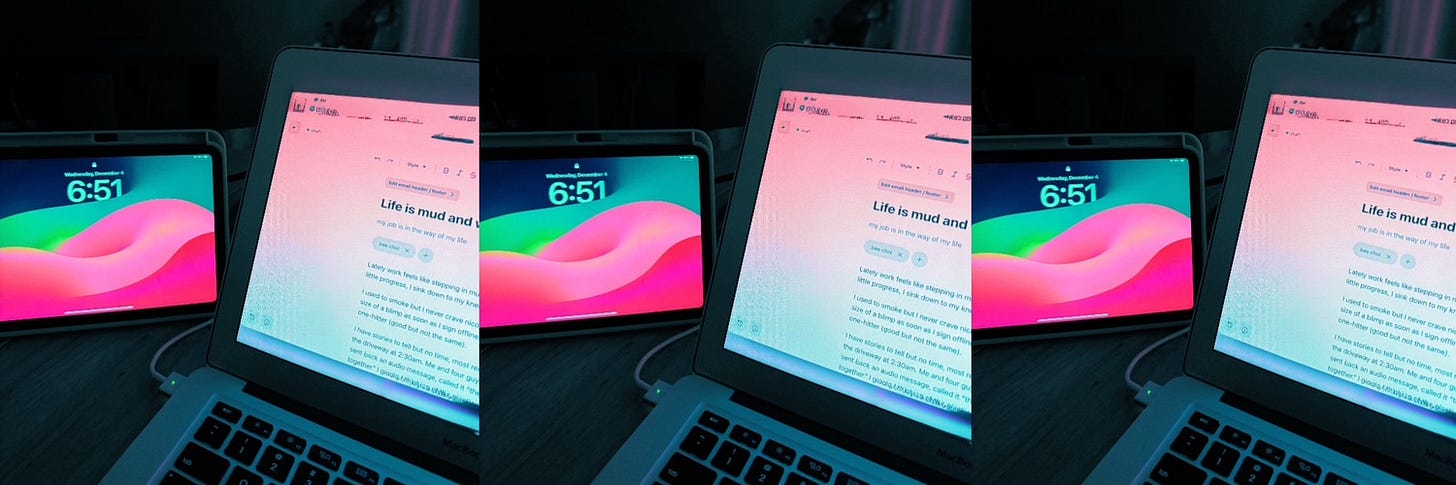 laptop screen glow and ipad lockscreen in background