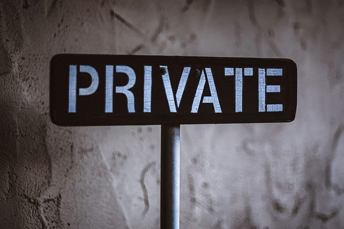 A simple sign, white font on a black background. It declares the space to be ‘Private’. A simple sign, white font on a black background. It declares the space to be ‘Private’.