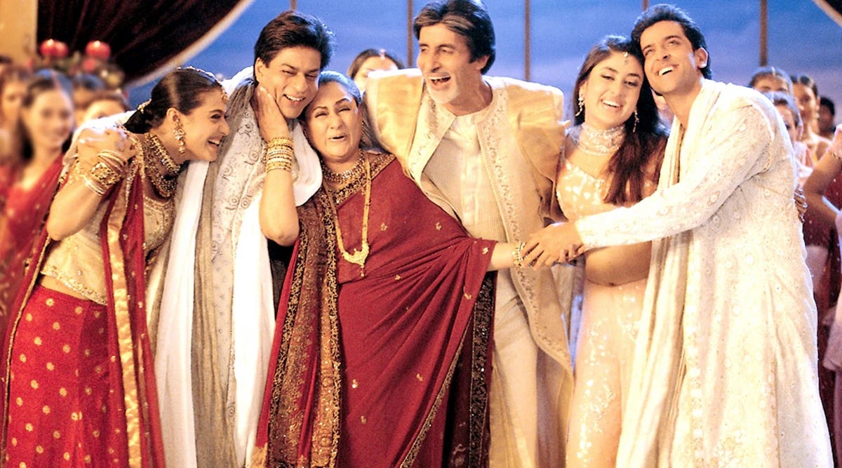 three men and three women in saris and wedding clothes