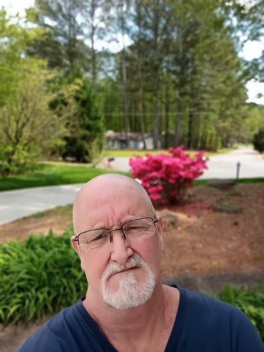 May be an image of one or more people and beard