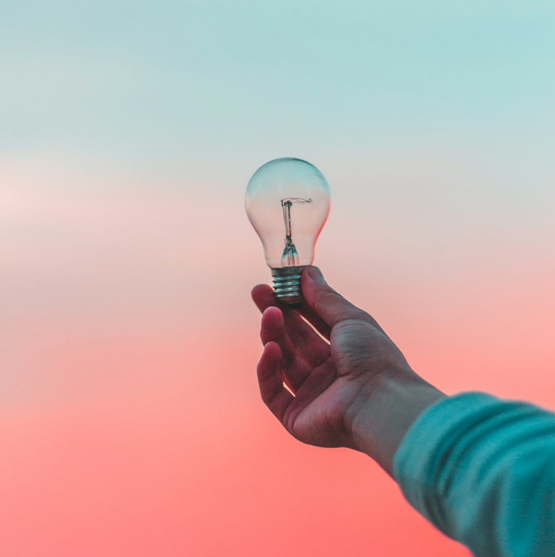 person holding light bulb