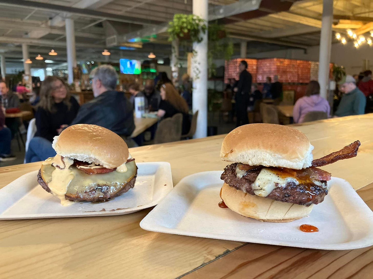 May be an image of 8 people and burger