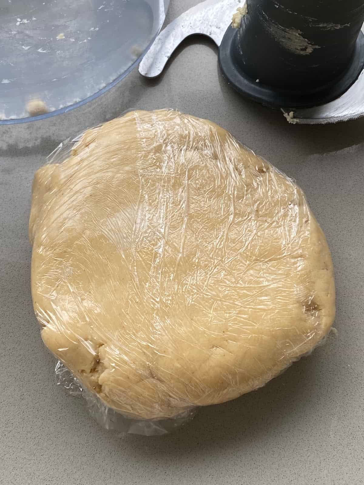 Pastry wrapped in cling film.