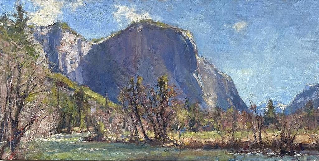 A mountain with trees in the background

Description automatically generated