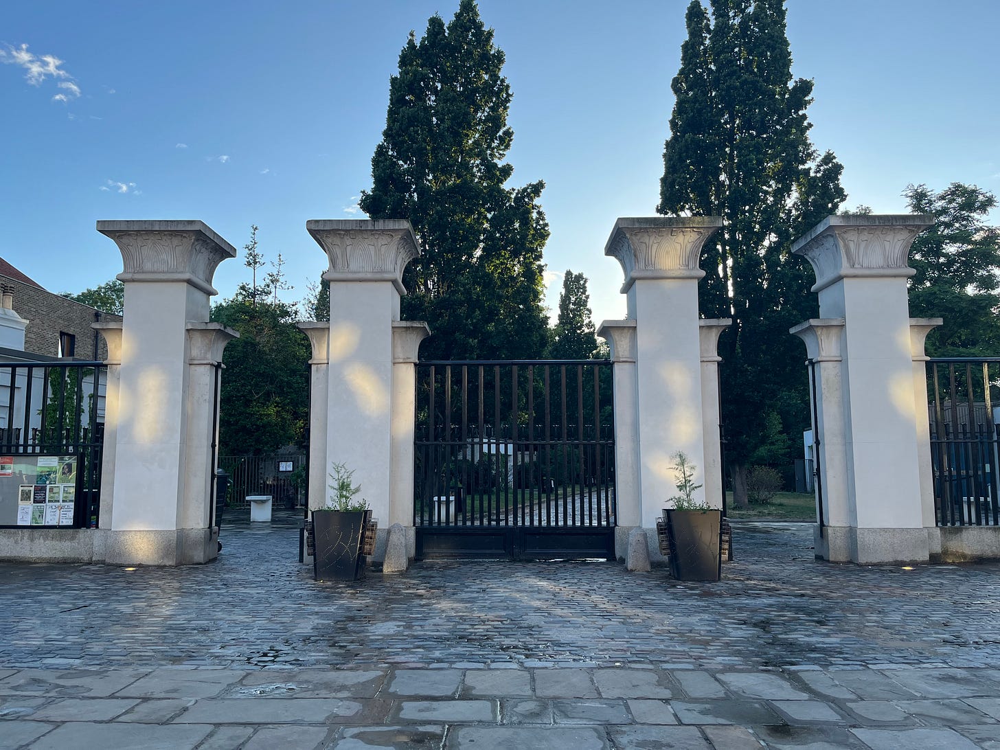 The four white Egyptian Revival pillars that form the main gate of Abney Park Cemetery The four white Egyptian Revival pillars that form the main gate of Abney Park Cemetery