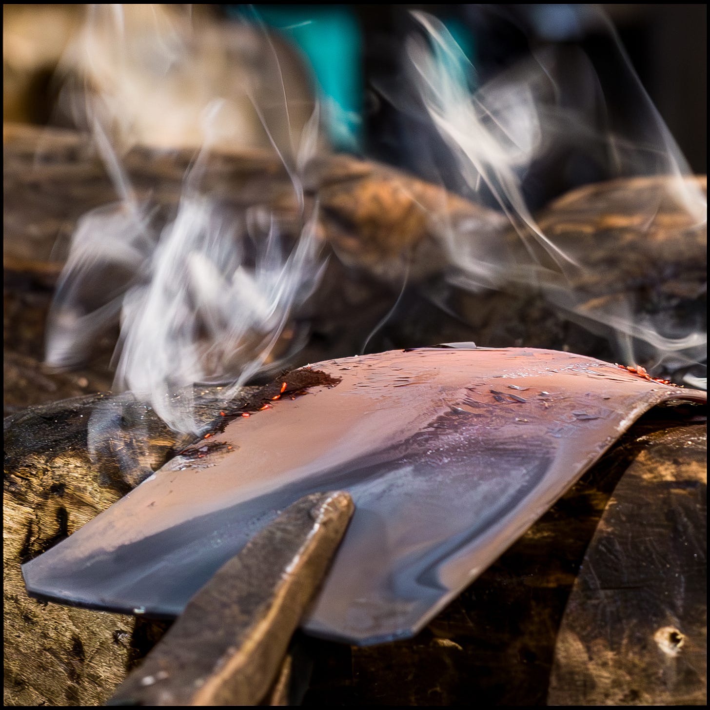 smoke emerges from forged metal