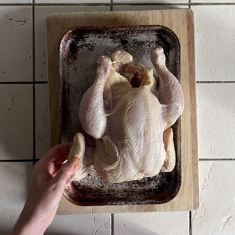 Tucking the chicken wing under for roasting