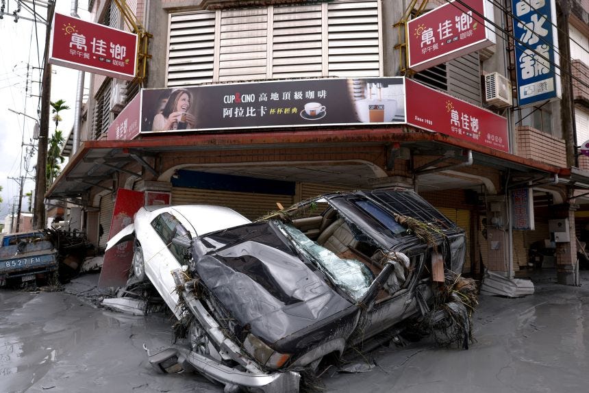 Damaged cars lie piled up in mud, following flooding brought by Super Typhoon Ragasa in Hualien, Taiwan, September 24, 2025.