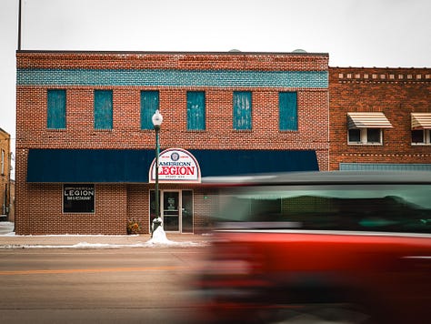 A city full of old stories, now guarded by God, guns, and flags proudly flown.